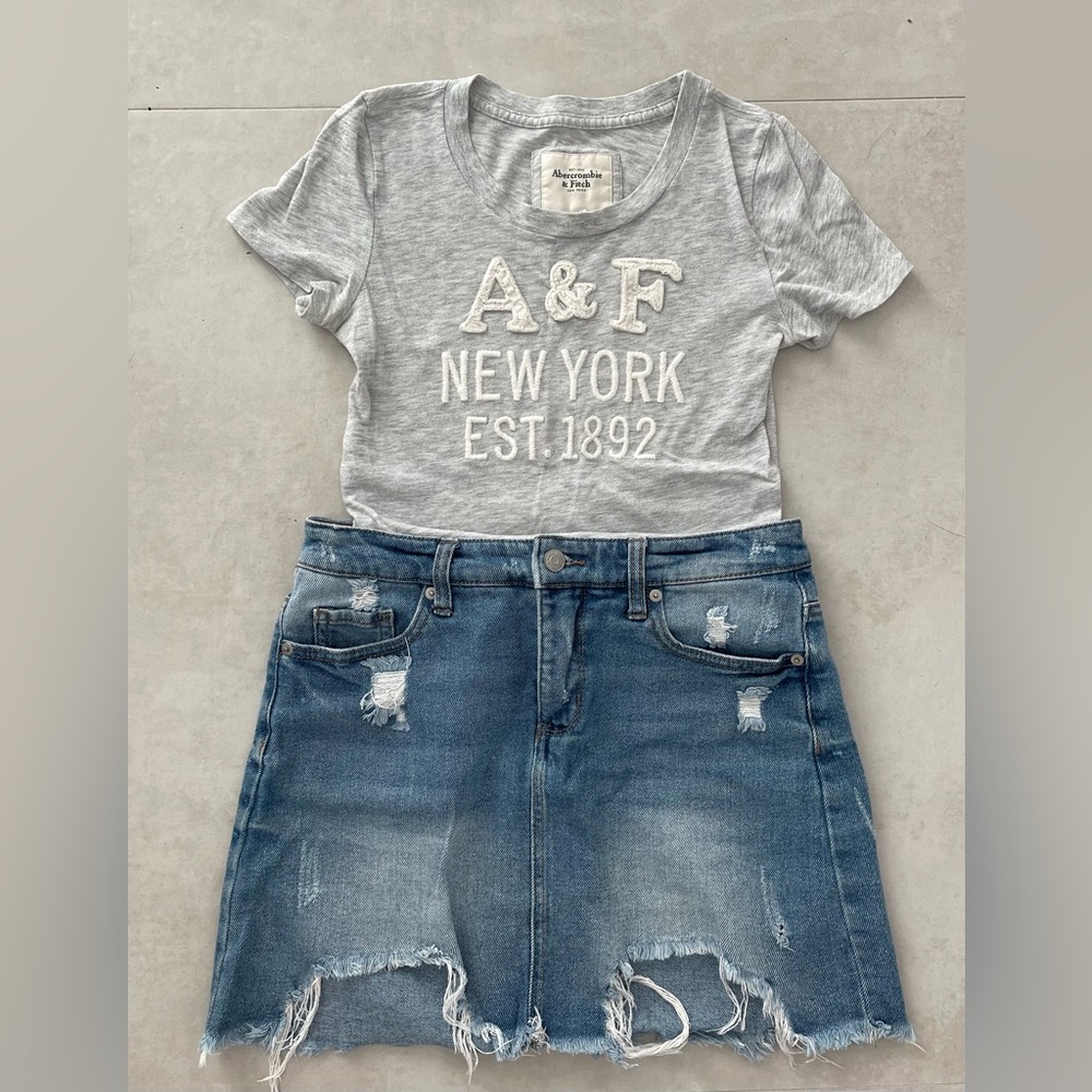 Abercrombie Grey T-shirt with denim blue jeans skirt.